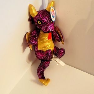 A small dragon with a tail and horns